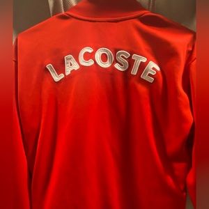 Vintage Lacoste Jacket size 14 but fits like a mens small. Beautiful color, red